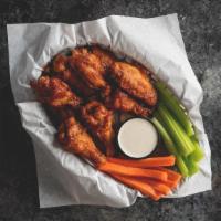 Wicked Wings · Choose between buffalo, BBQ or our sweet & spicy kickin' sauce. Served with celery sticks an...