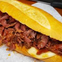 Pastrami In Sauce And Cheese Hot Sandwich · with cooked bell peppers and provolone cheese.
Tomato Sauce giving the Pastrami Italian Flav...