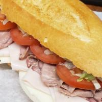 Roast Beef, Turkey And Cheese Cold Sandwich · Lettuce, tomato, mayonnaise and mustard.