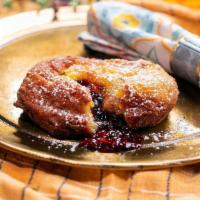 Beignet Doughnut Americian · brioche french toast deep fried doughnut filled with peanut butter and grape jelly.