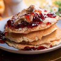 Crepes Pancakes Americian · 4 griddled buttermilk pancakes, smothered with chunky peanut butter and grape jelly, maple s...