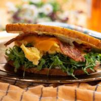 Delux Bacon Sourdough Sandwich  · sourdough, bacon, cheddar, egg, lemon herb aioli, arugula