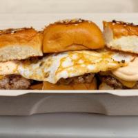 Brunch Sliders  · 3 Breakfast Beef Patties, Fried Egg, Tillamook Cheddar, Spicy Aioli, Hawaiian Rolls