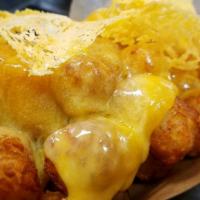 Cheesy Tots · Tillamook cheddar, side of ketchup.

Vegetarian & Able to modified to Vegan for an additiona...