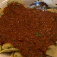 Meat Ravioli Al Pomodoro · Served with meat sauce.