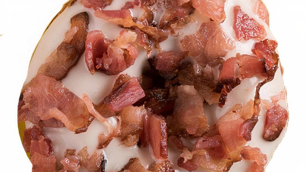 Maple Bacon · This savory and sweet tribute to everyone's favorite breakfast food is a real fan favorite. This daring donut has maple icing with pieces of bacon on top.