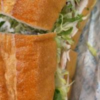 Turkey Club · Turkey breast with bacon and swiss cheese on a French baguette. Includes mayo, tomato and le...