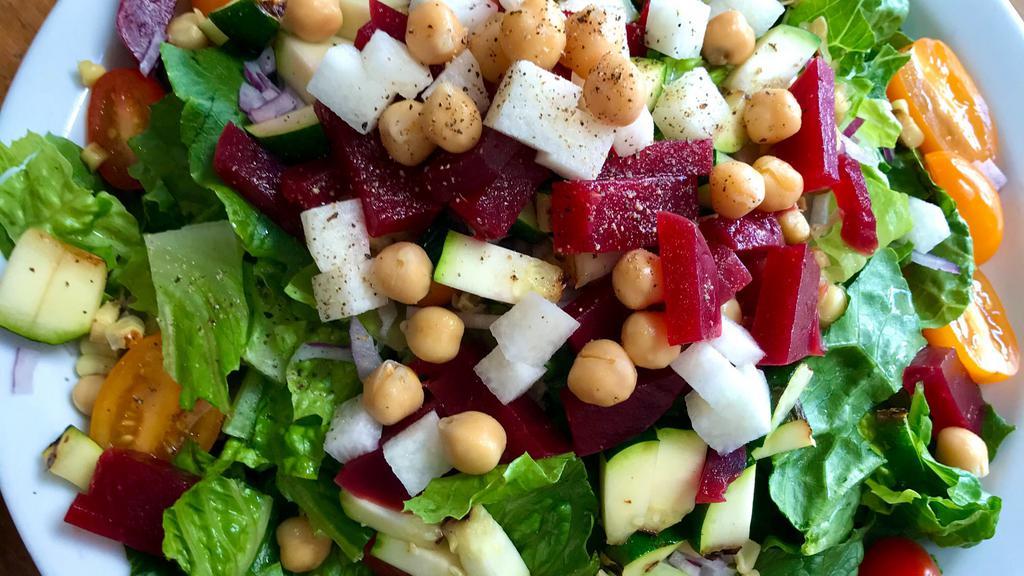 V Chopped · Served with roasted beets, jicama, grilled zucchini, garbanzo beans, roasted corn, tomato, red onion, chopped romaine, with balsamic vinaigrette