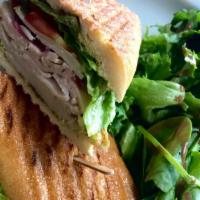 Roasted Turkey Sandwich · All natural roasted turkey, manchego cheese, pickled onion, tomato, basil aioli, and mixed g...