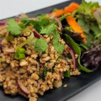 Chicken Larb · Seasoned with lime juice, chili peppers, cilantro, rice powder and onion