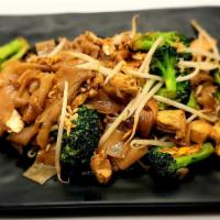 Pad See Ew · Thai street food dish made with flat, wide rice noodle stir fried in soy sauce with broccoli...