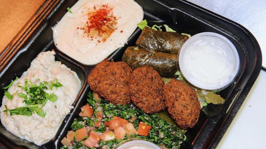 Appetizer Combo · Signature. Hummus, falafel, baba ghanoush, grape leaves & tabbouleh.
