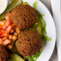 Falafel (4) · Mashed garbanzo & fava beans mixed with spices. Served with tahini sauce.