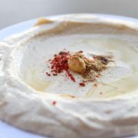 Original Hummus · Mashed garbanzo beans mixed with tahini sauce, garlic & lemon juice. Topped with olive oil.