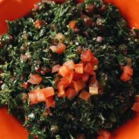 Tabbouleh (Salad) · Finely chopped parsley, tomato, onion & wheat bulgur. Mixed with lemon juice & extra virgin ...
