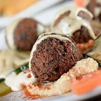 Falafel & Hummus · Our signature falafel served with hummus and pita bread.