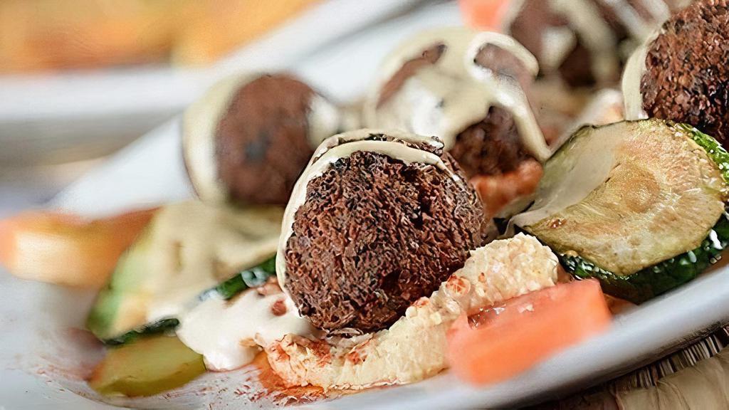 Falafel & Hummus · Our signature falafel served with hummus and pita bread.