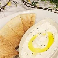 Labne · Creamy kefir cheese dip topped with extra virgin olive oil served with pita bread.