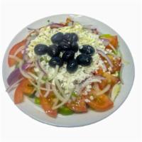 Greek Salad · Lettuce, tomatoes, onions, cucumbers, olives & feta cheese.