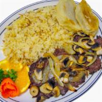 Beef Langet · Filet mignon sautéed in butter, served with sautéed mushrooms & onions.