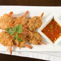 6 Pieces Coconut Shrimp · Shrimp lightly battered with shaved coconut to a crisp. Served with sweet and sour orange sa...
