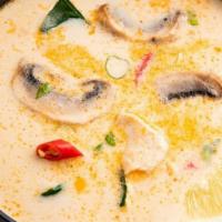 Tom Kha Soup · Coconut soup with galanga, lemongrass, lime juice, onions, tomatoes and mushrooms.