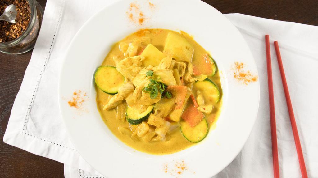 Yellow Curry · Simmered yellow curry with coconut milk, pineapples, onions, potatoes and carrots. Served with white rice.