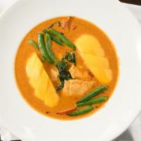 Mango Chicken Curry · Red curry simmered in coconut milk with chicken, green beans, bell pepper, chili, basil leav...