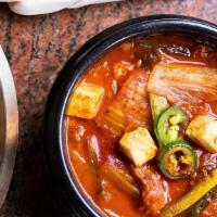 Kimchi Jjigae (Kimchi Stew) · Spicy kimchi stew with tofu, pork & vegetables.