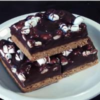 S'Mores Bar · moist graham cracker crust is topped with a mixture of rich chocolate and mini marshmallows.