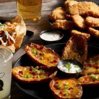 Loaded Potato Skins · Loaded with Jack and Cheddar cheeses, bacon, sour cream and green onions.