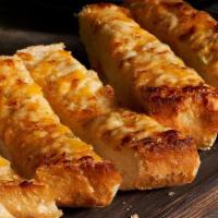 Three Cheese Garlic Bread · French bread topped with fresh garlic and Cheddar, Jack and Parmesan cheeses.