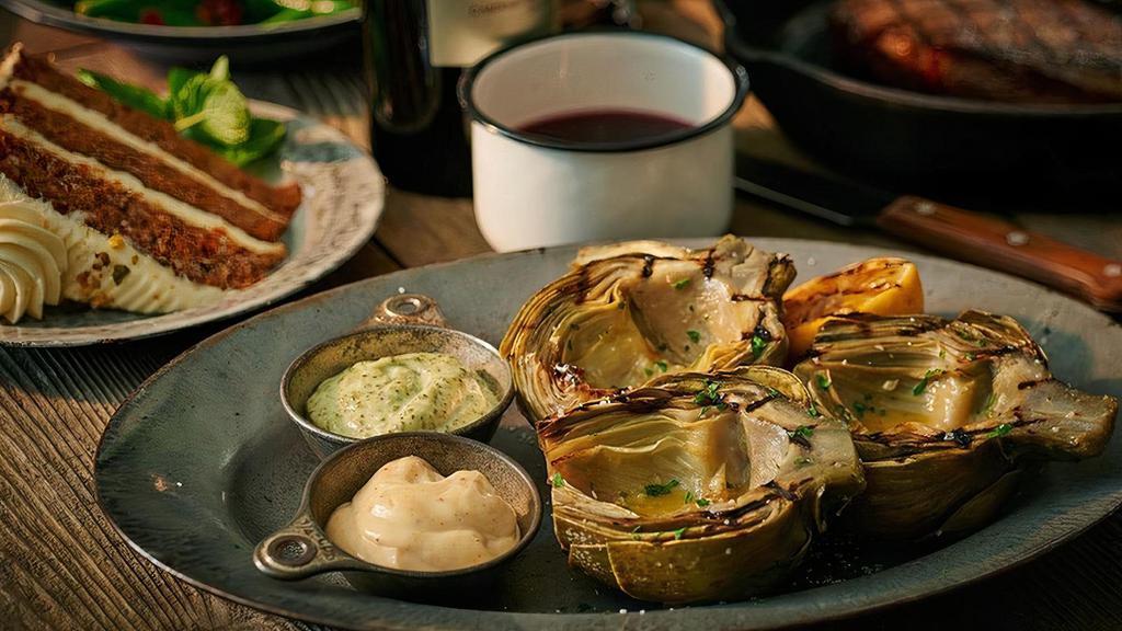 Grilled Artichoke · Served with our house-made lemon aioli and our signature basil pesto mayo for dipping.
