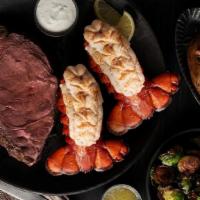 Prime & Lobster · Half Pound of slow roasted Prime Rib paired with our cold-water Atlantic Lobster Tails.