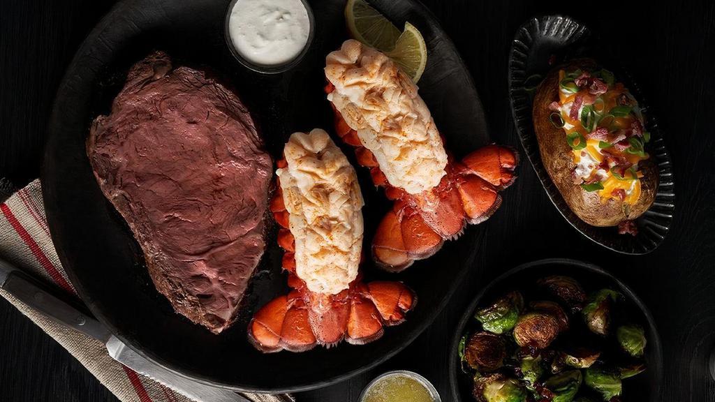 Prime & Lobster · Half Pound of slow roasted Prime Rib paired with our cold-water Atlantic Lobster Tails.