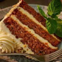 Spiced Carrot Cake · Slice of carrot cake, with pineapple and walnuts, a dash of vanilla and cinnamon, layered to...
