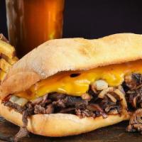 Filet Mignon Sandwich · Sliced filet mignon topped with sautéed onions, cheddar cheese, and house-made chipotle mayo...