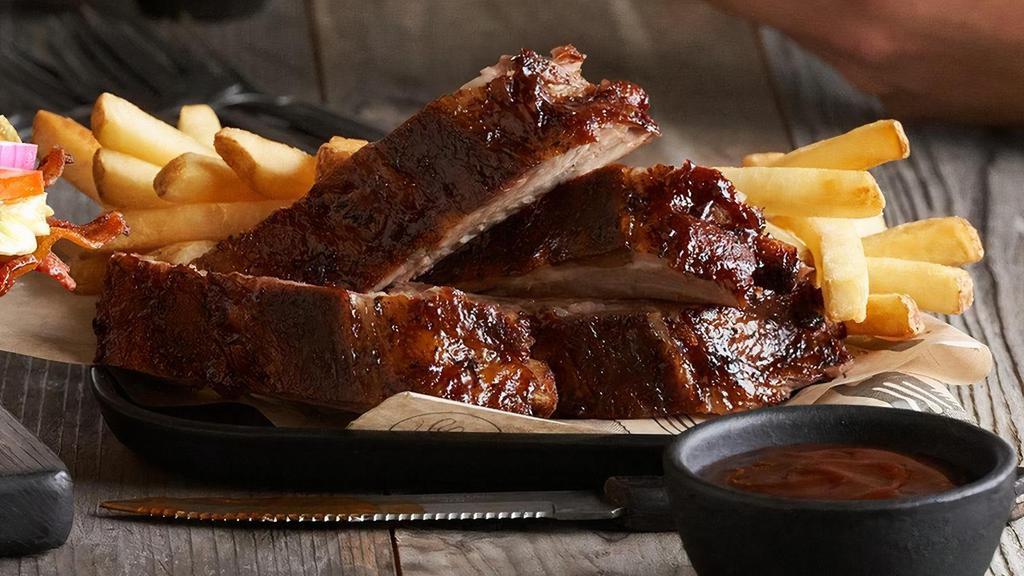 Bbq Pork Ribs - Full Rack  · Our fall-off-the-bone ribs marinated, seasoned with spices, slow roasted, and finished over an open flame. Smothered in our smoky molasses BBQ sauce.