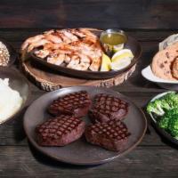 Surf & Turf Family Meal · (4) 8oz Top Sirloin Center-Cut, Fire-Grilled Jumbo Shrimp, Home-Style Mashed Potatoes or Ric...