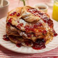 Pbj Range Grilled Pancakes · 4 griddled buttermilk pancakes, smothered with chunky peanut butter and grape jelly, maple s...