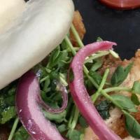 Crispy Pork Belly Slider · Soy crema, jalapeños, pork belly, pea sprouts, cilantro and pickled onions