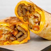Impossible Sausage, Egg, & Cheddar Breakfast Burrito · Delicious vegetarian option for your savory breakfast burrito. 3 fresh cracked, cage-free sc...