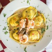 Shrimp Scampi With Ravioli · Jumbo shrimp and ravioli stuffed with shrimp and Italian cheeses in a buttery lemon sauce.