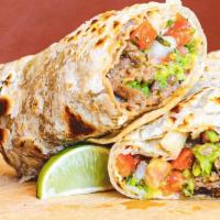 Carne Asada Burrito · Guacamole, pico de gallo, and beans.