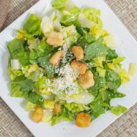 Caesar Salad · Crisp romaine lettuce tossed with our homemade garlic croutons, gourmet Parmesan cheese in a...