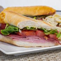 Italian Grinder · The ferrari of Italian sandwiches. Smoked ham, salami, mortadella, melted provolone cheese, ...