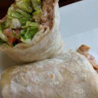 Veggie Burrito · Pinto beans, rice, lettuce, cheese, guacamole and salsa fresca.