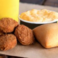 Kids' Chicken Nuggets Meal · Includes a meat and a side of your choice, together with Lil' Yellow Cup and a roll.
