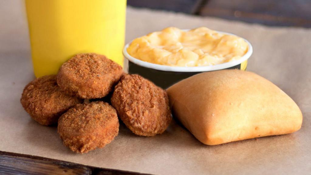 Kids' Chicken Nuggets Meal · Includes a meat and a side of your choice, together with Lil' Yellow Cup and a roll.