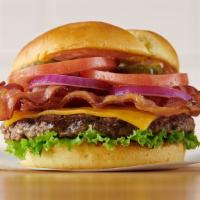Cheddar Bacon Burger · Smothered in applewood smoked bacon, melted cheddar, lettuce, tomatoes, red onions, pickles,...